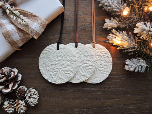 simple circular leaf print ornament in white clay