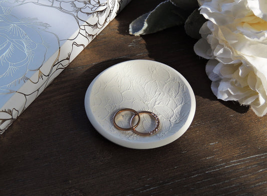 white floral ring dish with botanical elements for photography flat lay kit